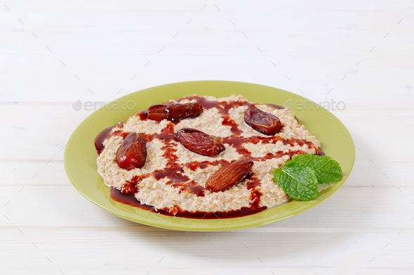 oatmeal porridge with dates Stock Photo by Vikif | PhotoDune