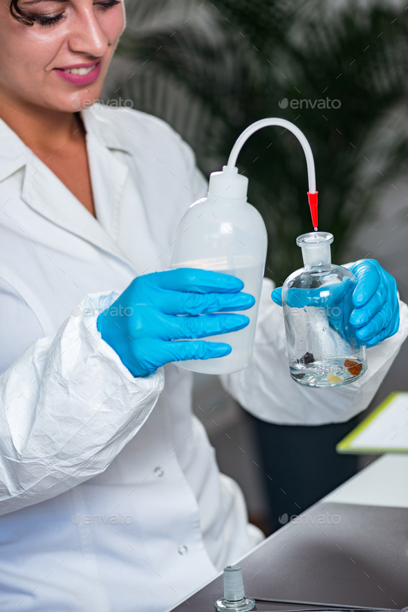 Food safety inspector working in laboratory Stock Photo by microgen