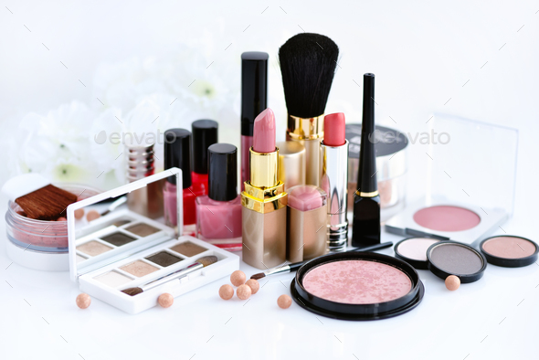 Set of decorative cosmetic: powder, lipsticks, brush, blush, eye Stock Photo by Nataljusja
