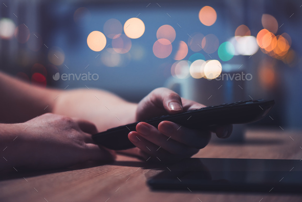 Female hand with television remote control Stock Photo by stevanovicigor