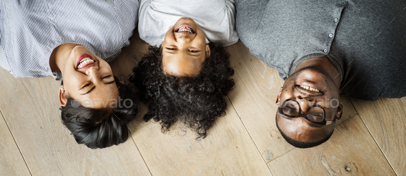 Black family lying on wooden floor design space Stock Photo by Rawpixel