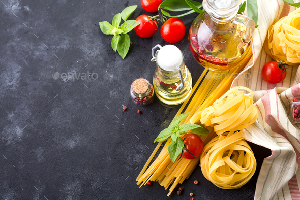 Food ingredients for Italian spaghetti on black stone slate background Stock Photo by lyulkamazur