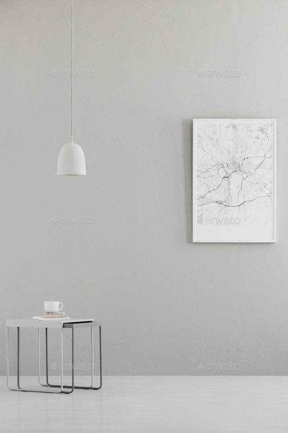 Pendant light above a modern table and a city map poster on a gr Stock Photo by bialasiewicz