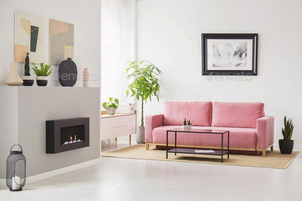 Posters on walls in Scandi sitting room interior with pink velve Stock Photo by bialasiewicz