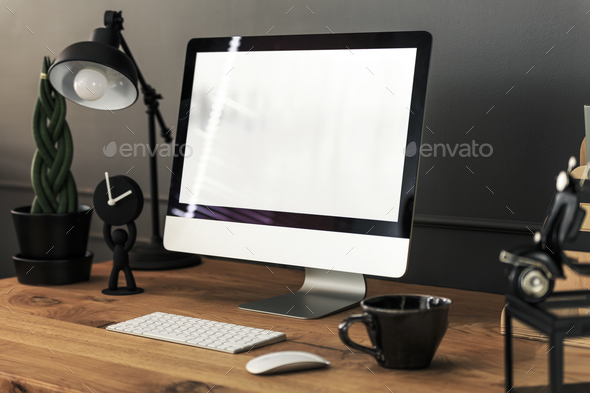 Keyboard, mouse and desktop computer on wooden desk with lamp in Stock Photo by bialasiewicz