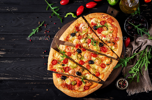 Delicious Seafood Shrimps And Mussels Pizza On A Black Wooden Table