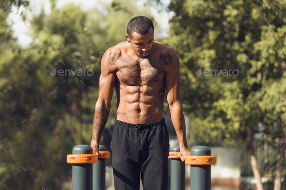 Athletic Naked Man Doing Push Ups On Parallel Bars Stock Photo By