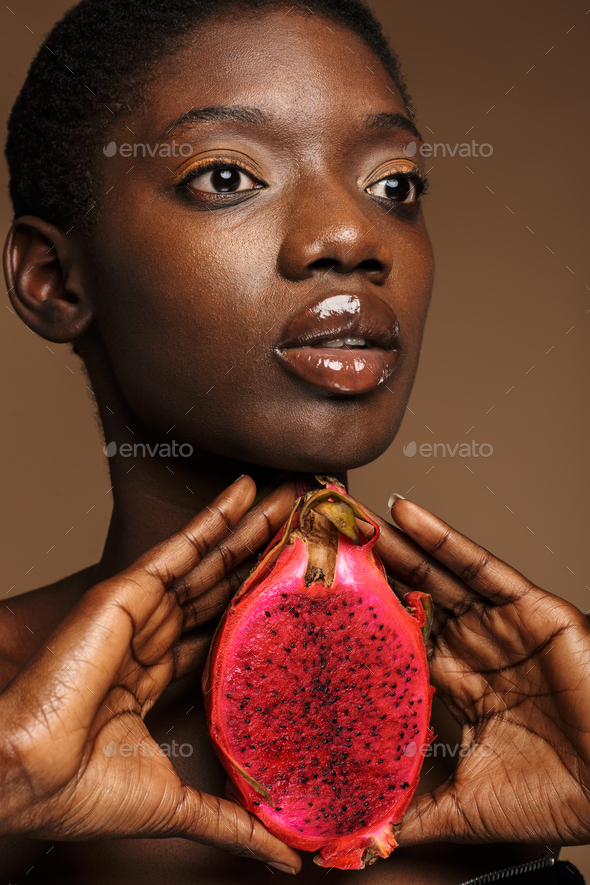 Beauty Portrait Of Half Naked African Woman Holding Pitaya Dragon Fruit