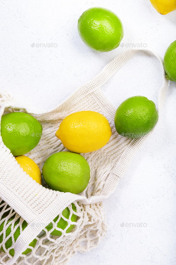 Organic Lemons And Limes In Reusable Eco Friendly String Mesh Bag Stock