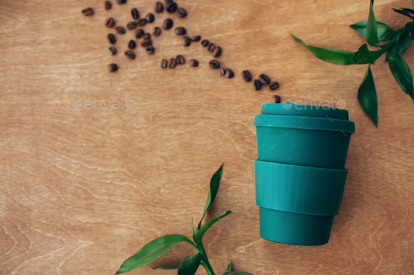 Stylish Reusable Eco Coffee Cup With Roasted Coffee Beans Stock Photo