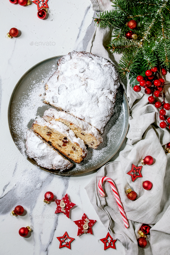 Christmas Baking Stollen Cake With Xmas Decorations Over White Marble