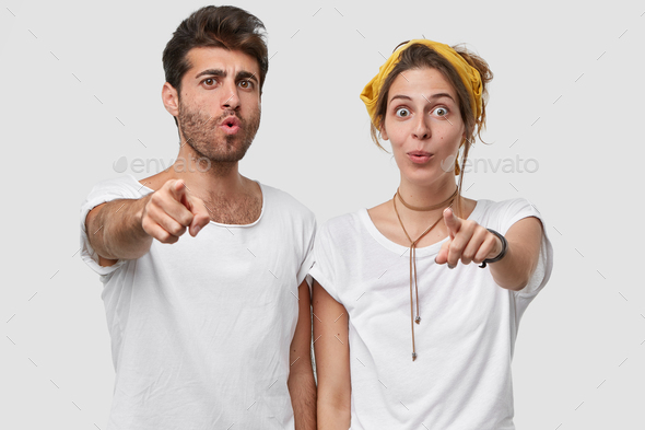 Horizotal View Of Emotive Surprised Caucasian Unshaven Man And Lady