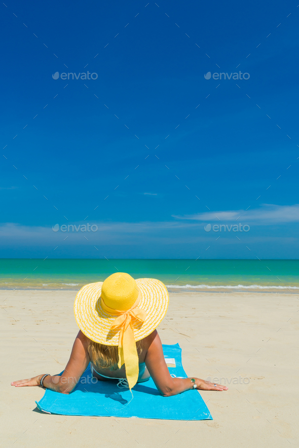 Woman In Bikini Wearing A Yellow Hat At Tropical Beach Stock Photo By