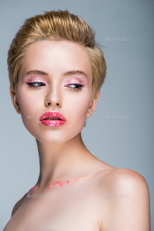 Attractive Naked Woman With Glitter On Face And Body Looking Away