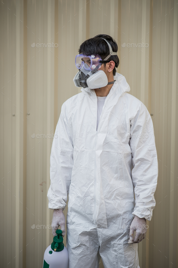 Disinfection Specialist Man In Ppe Suit Performing Public