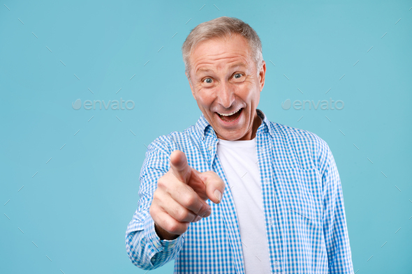 Happy Mature Man Pointing Fingers At Camera At Studio Stock Photo By