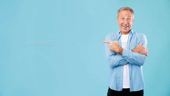 Excited Mature Man Pointing Aside At Copy Space Stock Photo By Prostock