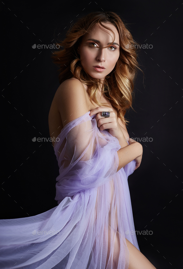 Naked Woman Art In Lilac Light Transparent Dress Posing On A Dark