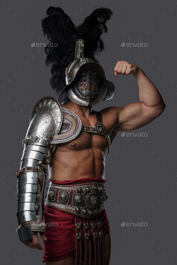 Strong Roman Gladiator Dressed In Light Armor And Plumed Helmet Stock