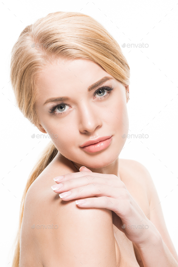 Attractive Naked Woman Touching Shoulder And Looking At Camera Isolated