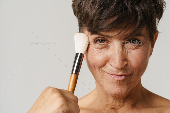 Mature Half Naked Woman Smiling While Using Powder Brush Stock Photo By