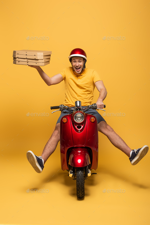 Happy Delivery Man In Yellow Uniform Riding Scooter With Pizza Boxes On