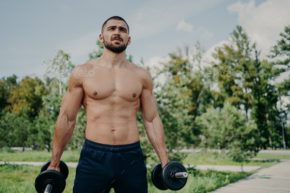 Fitness Athlete Muscular Man Holds Barbells In Hands Has Naked Perfect