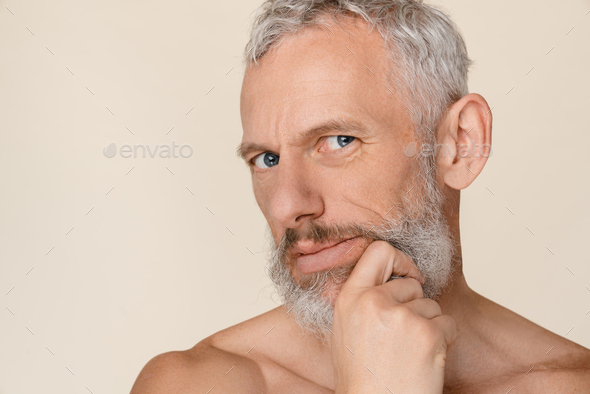 Pensive Thoughtful Caucasian Mature Naked Shirtless Man With Bare