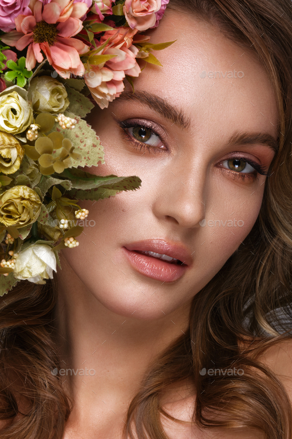 Beautiful Woman With Classic Nude Make Up Light Hairstyle And Flowers