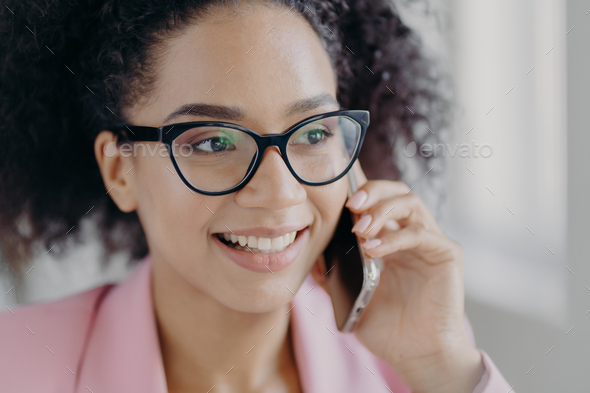 Headshot Of Beautiful Smiling Dark Skinned Woman Wears Optical Glasses