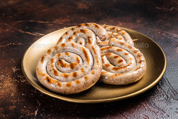 Bavarian Roasted Spiral Pork Meat Sausages With Herbs Dark Background