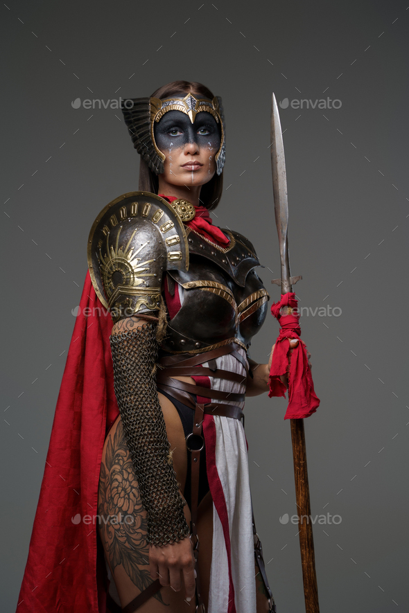 Tattooed Woman Warrior With Red Cape And Spear Stock Photo By Fxquadro