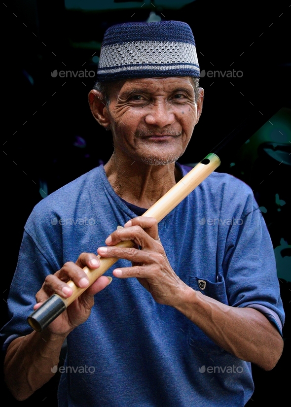 Portrait Of A Flute Player A Traditional Musical Instrument From West Java Made Of Special