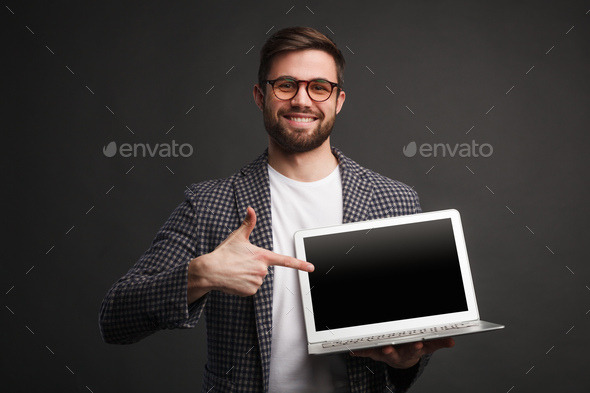 Smiling Man Pointing At Laptop Stock Photo By Kegfire PhotoDune