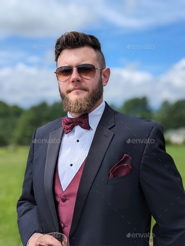 Man In A Tux Holding A Glass Of Scotch Groom In Tuxedo With Sunglasses