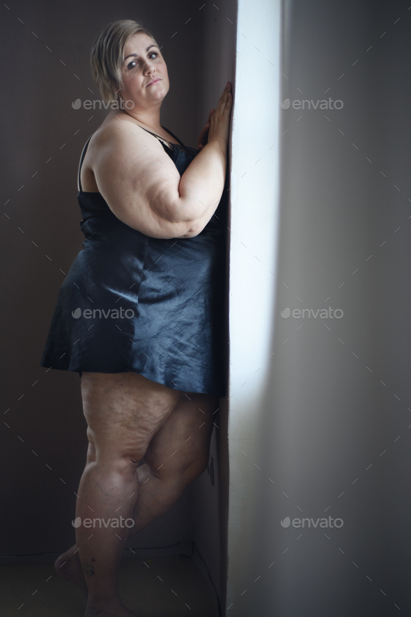 Depressed Lonely Fat Woman In Underwear Looking Down And Thinking At