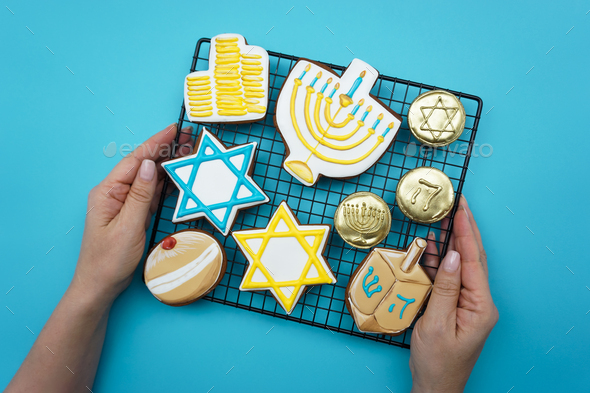 Women S Hands Hold A Lattice With Gingerbread Symbols Of Hanukkah Stock