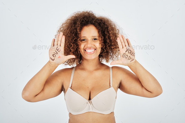 Glad Plus Size Lady In Lingerie Demonstrating Motivational Words Stock