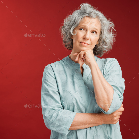 Mature Woman Thinking Making A Decision Or Choice About What To Wear