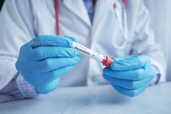 Hand In Blue Medical Gloves Holding Blood Test Tube Stock Photo By