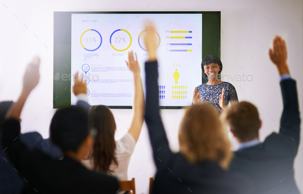 Workshop In Progress Shot Of A Group Of People Raising Their Hands In