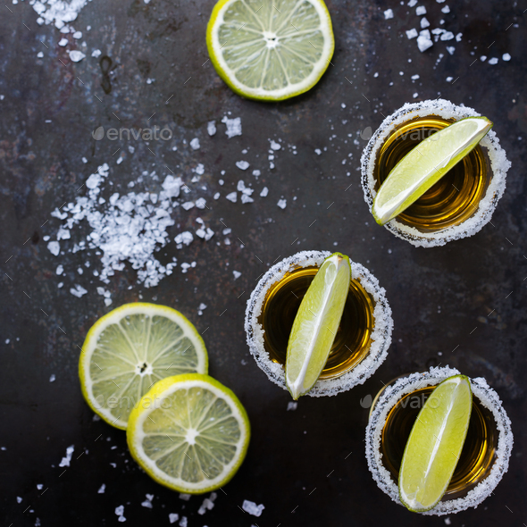 Golden Mexican Tequila Shot With Green Lime And Salt Stock Photo By