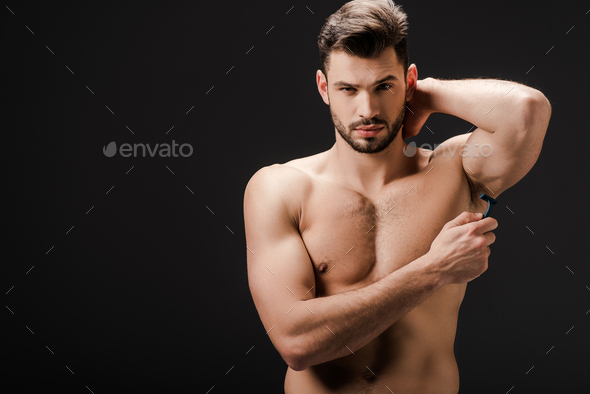 Handsome Naked Man Shaving Armpits With Razor Isolated On Black Stock