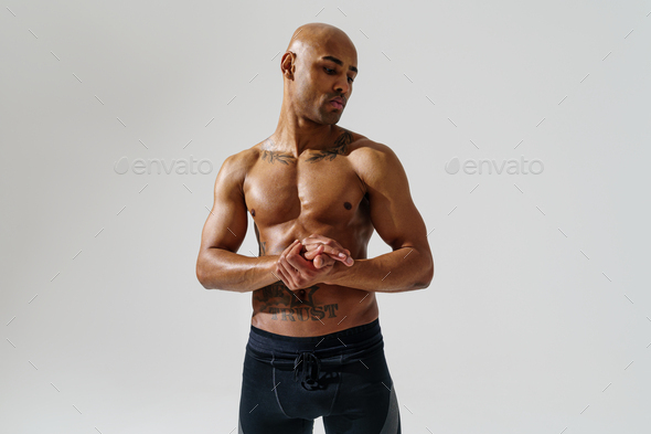 Portrait Of Sporty Man With Muscled Naked Body On White Studio