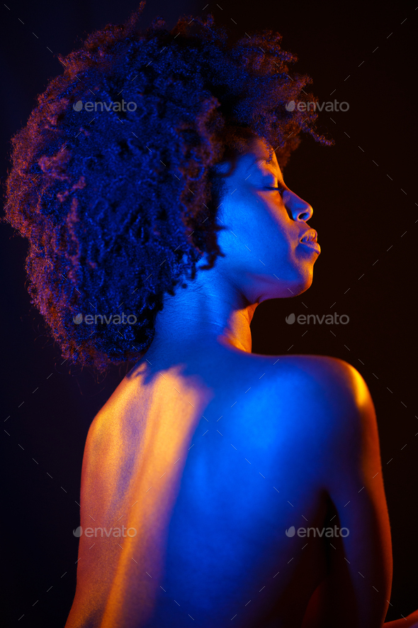 Naked Black Woman Afro Hairstyle Under Neon Illumination Stock Photo