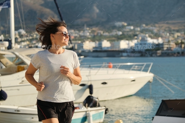 Sporty Mature Woman Jogging Running At Promenade Stock Photo By