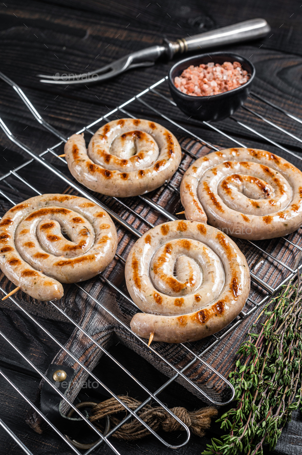 Bbq Grilled Spiral Pork Meat Sausages On A Grill Black Background Top