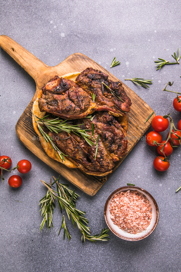 Grilled Rib Eye Steak Ribeye Beef Marbled Meat On A Board With Tomato