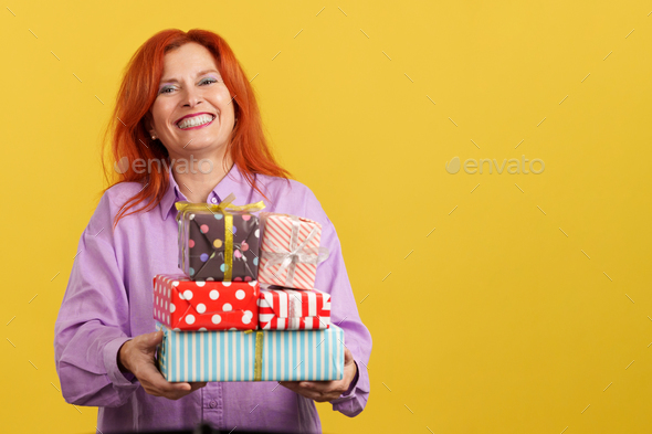 Happy Redheaded Mature Woman Receiving Gifts For The Mother S Day Stock