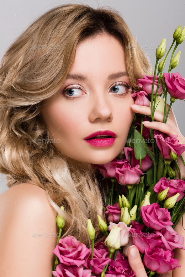 Naked Beautiful Blonde Woman Posing With Eustoma Flowers Isolated On